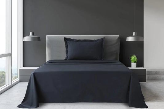 Grey Single and King Single percale sheet set with matching pillowcase displayed on a modern hotel-style bed.