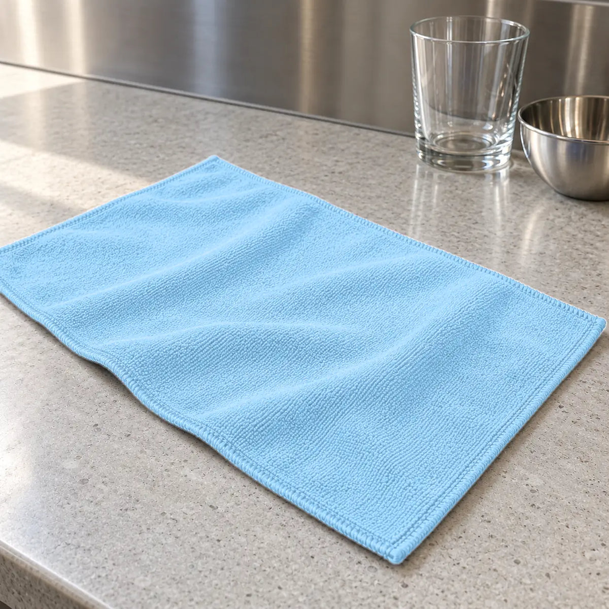 Large light blue microfibre cleaning cloth 60 x 40 cm laid flat on a kitchen bench NZ