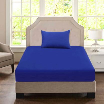 Navy blue King Single polycotton fitted sheet and matching pillowcase displayed on an accommodation-style bed.