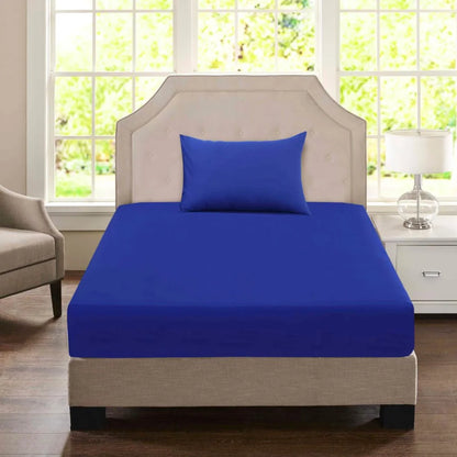 Navy blue Single economy fitted sheet with matching pillowcase styled on a commercial accommodation bed.