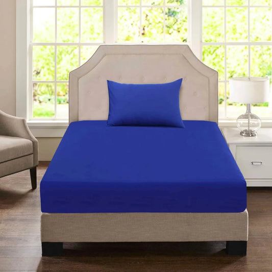 Navy blue Single economy fitted sheet with matching pillowcase styled on a commercial accommodation bed.