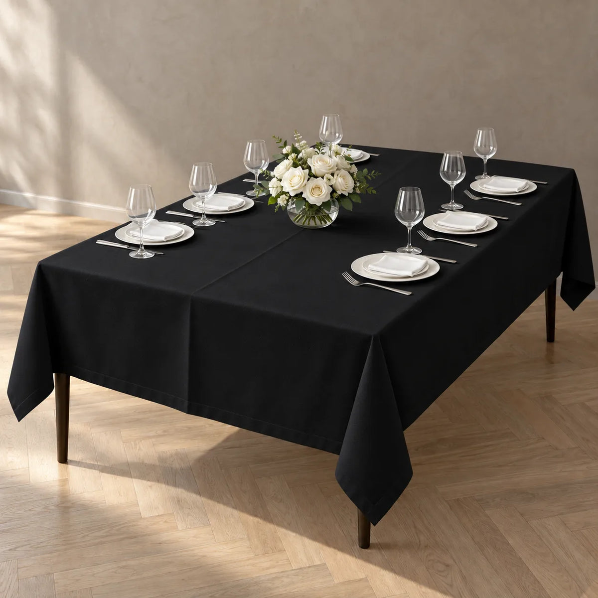 Black heavy duty table cloth 150 x 244 cm on a fine dining and event table NZ