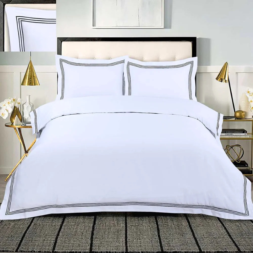 White 100% cotton duvet cover set with black embroidered border and matching pillowcases.