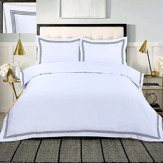 White 100% cotton duvet cover set with black embroidered border and matching pillowcases.