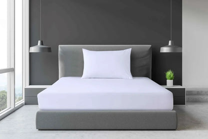 White Single and King Single percale fitted sheet displayed on a modern accommodation-style bed with a white pillow.